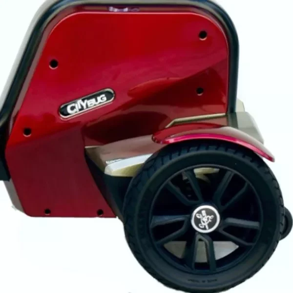 EV Rider CityBug folding mobility scooter in red, featuring a 16-inch seat and solid tires, designed for versatile indoor and outdoor use.