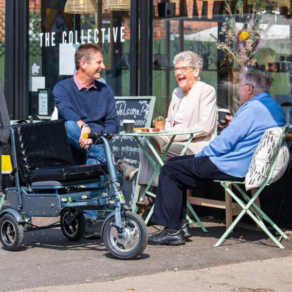 eFOLDi Explorer scooter, lightweight foldable design, padded seat, large wheels, perfect for travel and urban mobility.