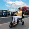 eFoldi Lite 12 eFOLDi Lite ultra-lightweight folding mobility scooter with a magnesium alloy frame, designed for easy transport and travel.