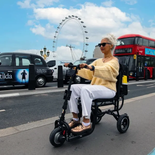 eFOLDi Lite ultra-lightweight folding mobility scooter with a magnesium alloy frame, designed for easy transport and travel.