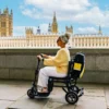 eFoldi Lite 13 eFOLDi Lite ultra-lightweight folding mobility scooter with a magnesium alloy frame, designed for easy transport and travel.