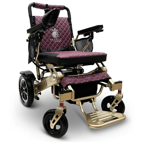 Majestic IQ‑7000 electric wheelchair with remote control, padded seat, folding frame, and large rear wheels—ideal for travel and everyday use.